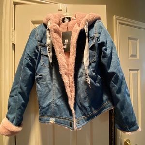 Denim jacket with faux light pink fur lining